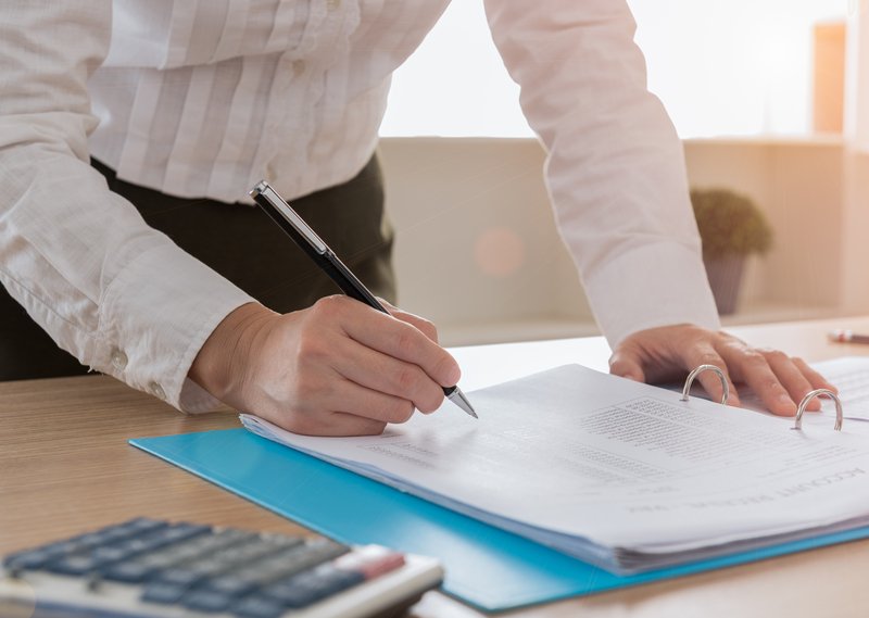 Business woman reviewing a compilation engagement report